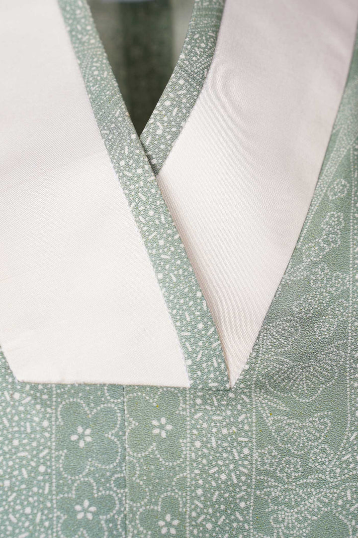 V-Neck Light Sage Green Patterned Silk Blouse with Off-White Lapel and Trimming